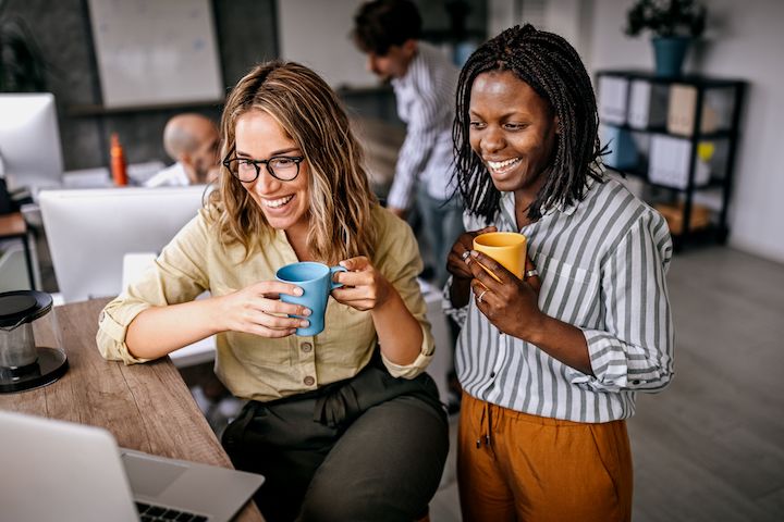 Diverse group of colleagues discussing something in an office