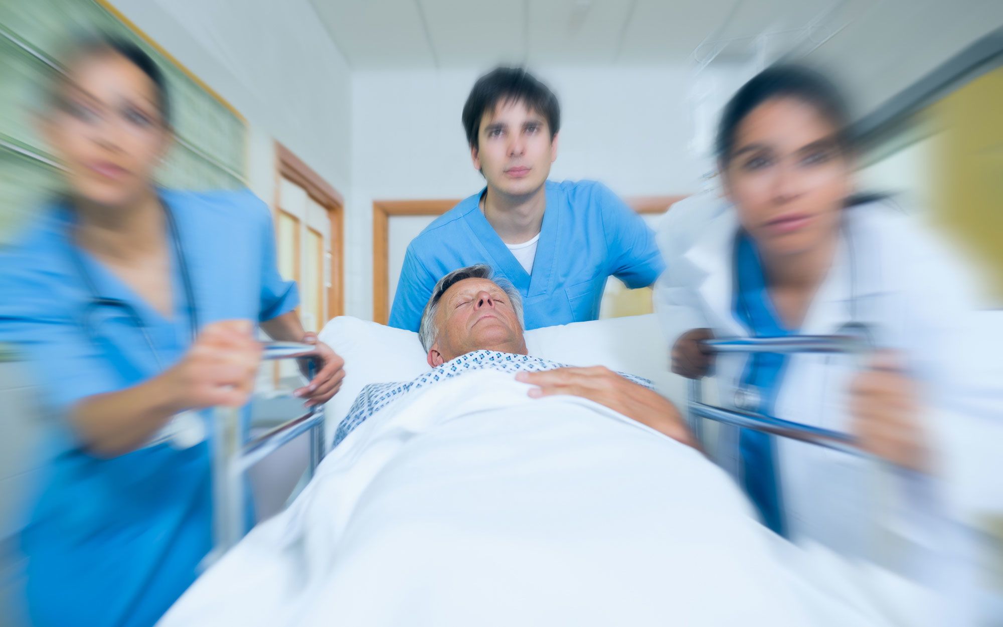 doctors rush through emergency room
