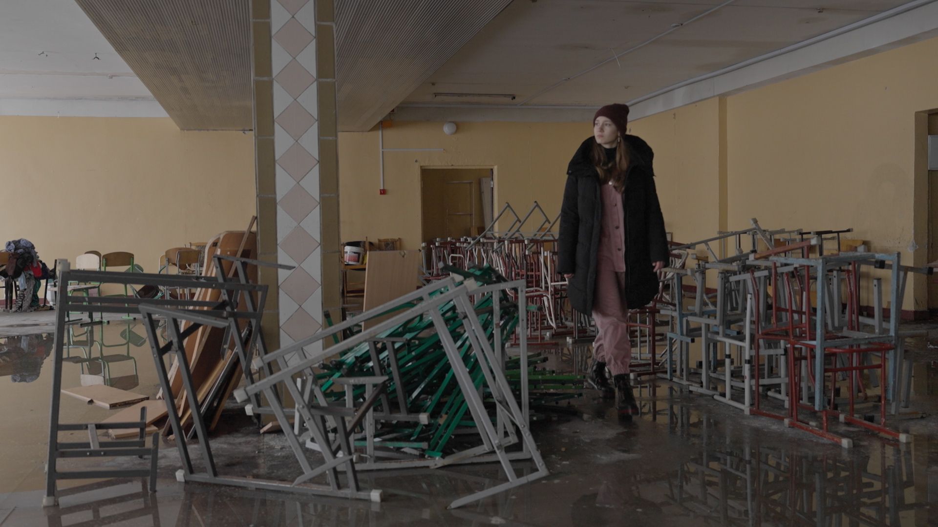14-year-old Sonia walks through her damaged school in Irpin, Ukraine