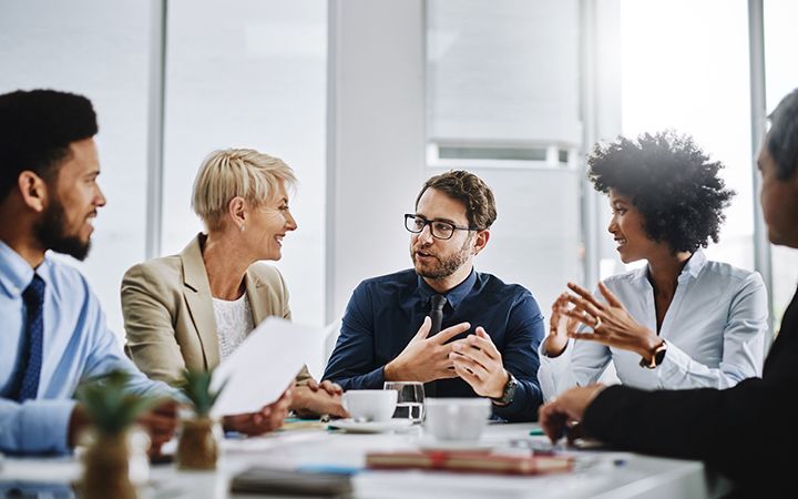 people talking around table