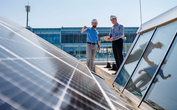 Contractors looking at solar panels