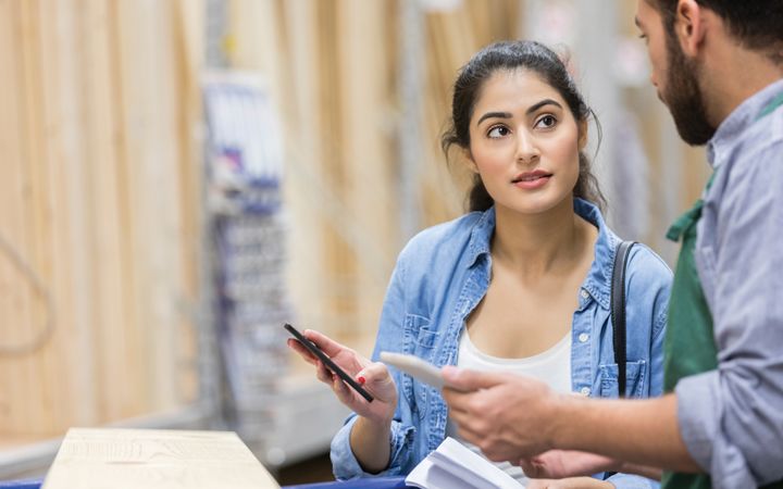 retail home improvement customer talking to employee