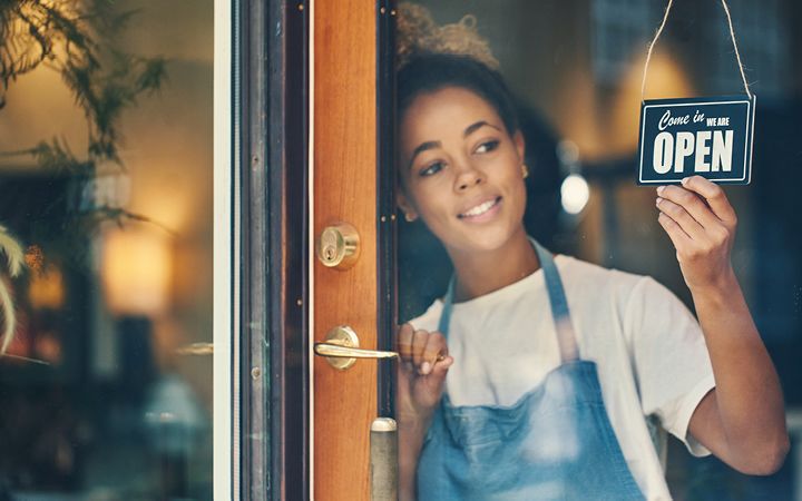 Woman opening a store