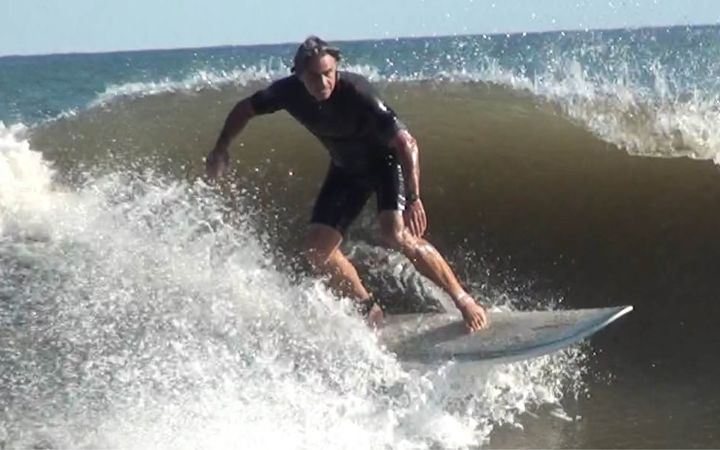 Damian surfing on his 50th birthday