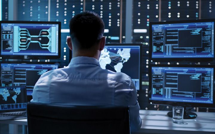 Cybersecurity guy working at his desk