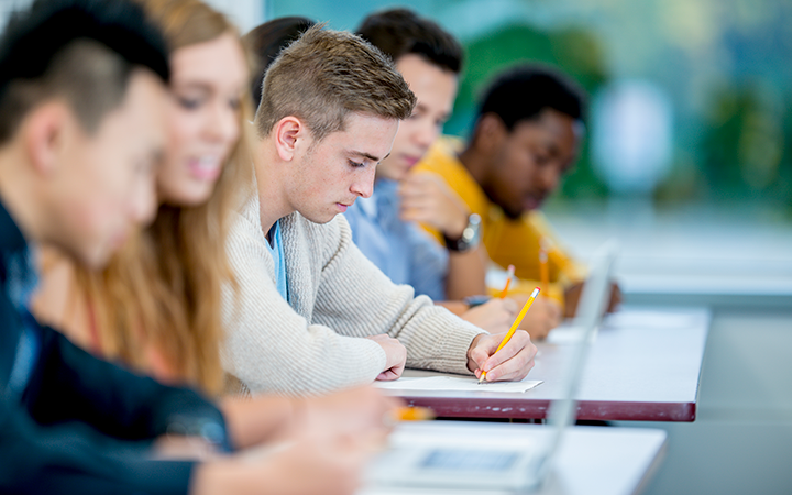 High school students, taking notes in class