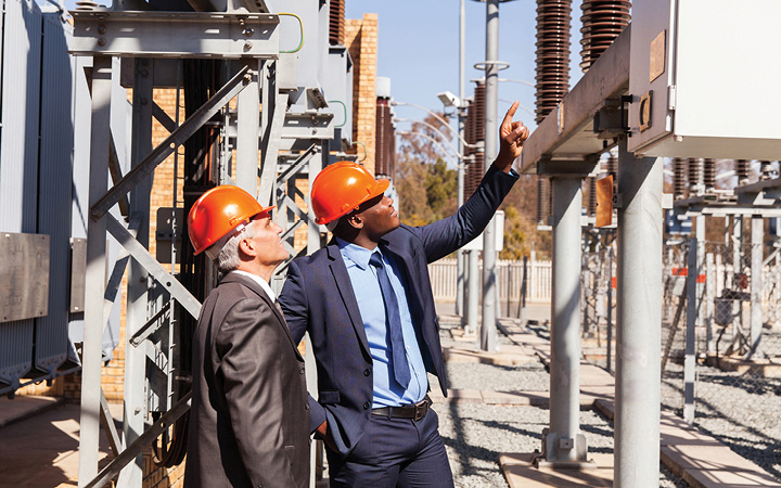 Men evaluating a building