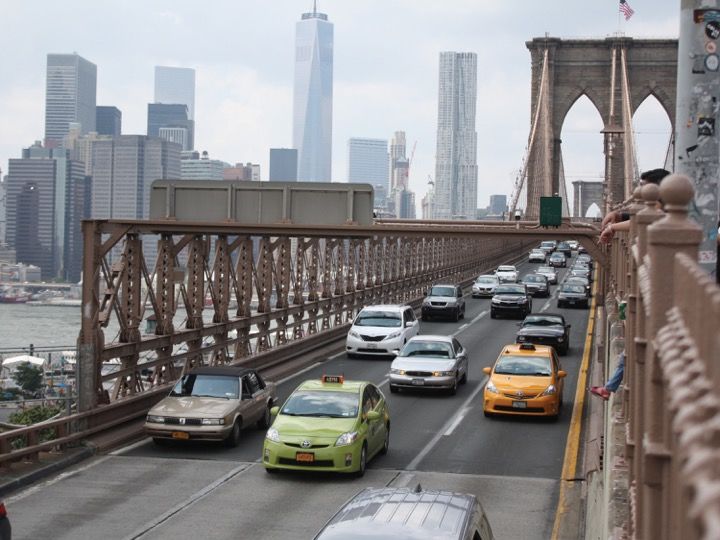 cars crossing brooklyn bridge