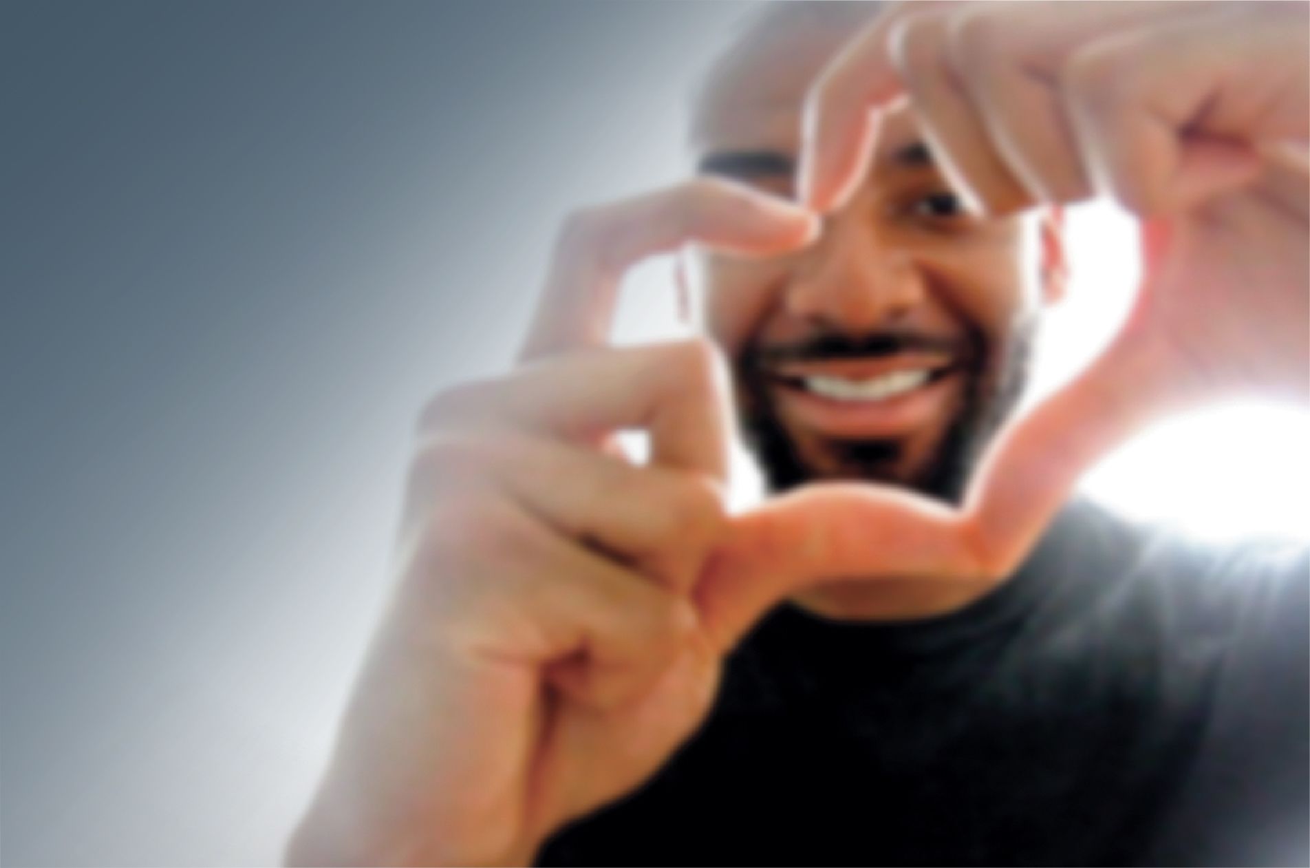 Man making heart with hands