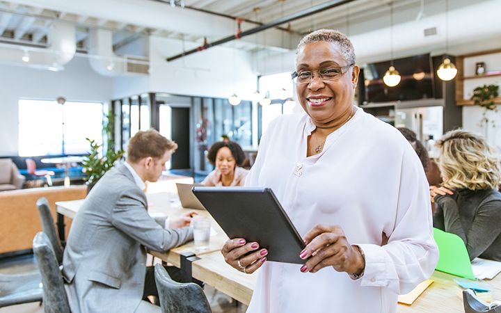 Woman using tablet in office setting