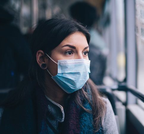 woman public transportation wearing mask during covid-19 pandemic