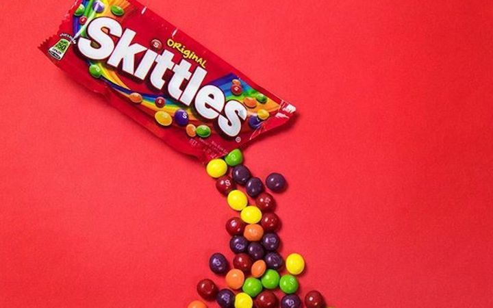 skittles candy pouring out of package