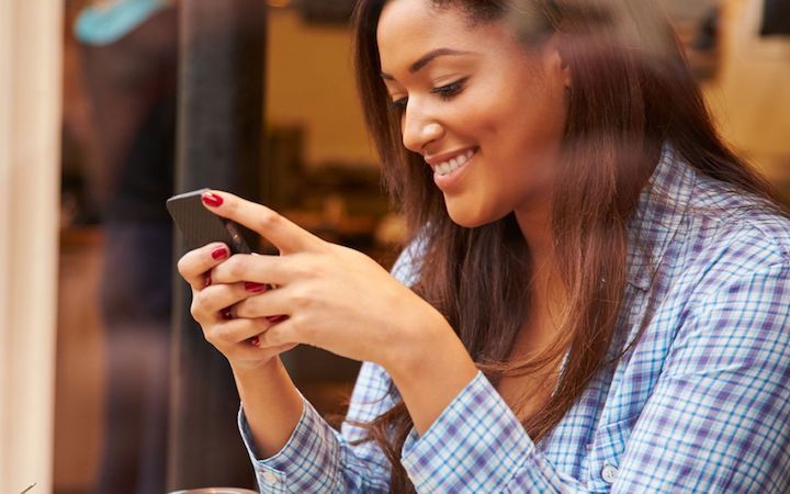 women typing on her cellphone