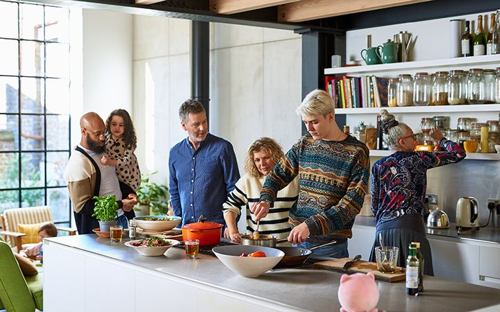 Family and friends gathering in a kitchen