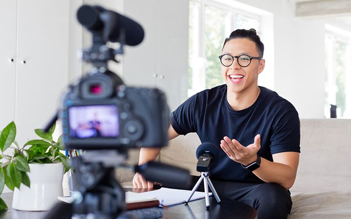 Young male talking into camera recording him