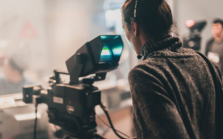 Women looking into camera thats recording