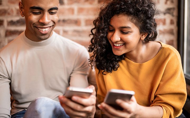 couple with phones up close